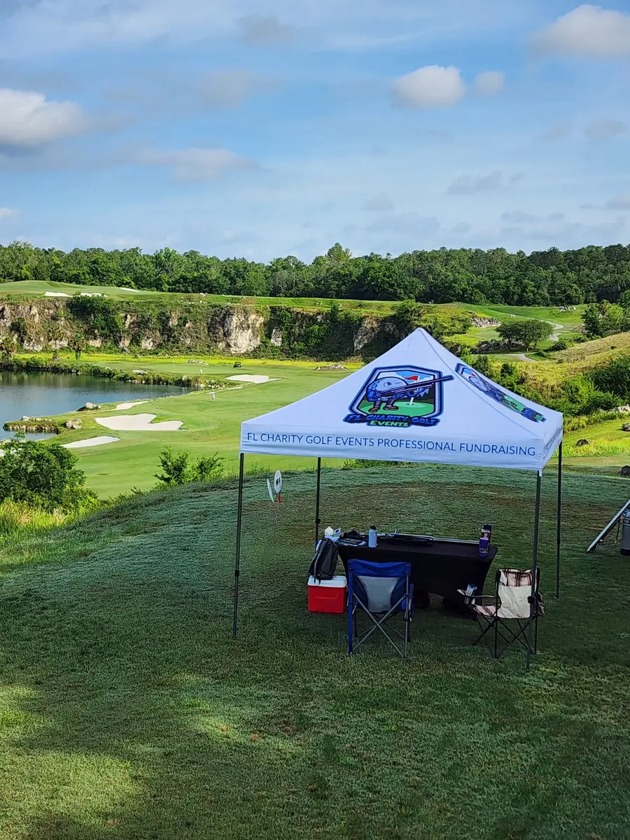 FL Charity Golf Events tent overlooking a golf course