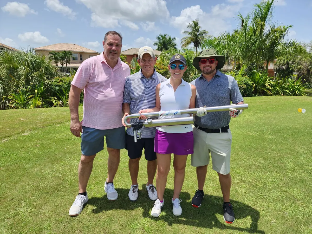 Golf group posing with the FL Charity Golf Events launcher