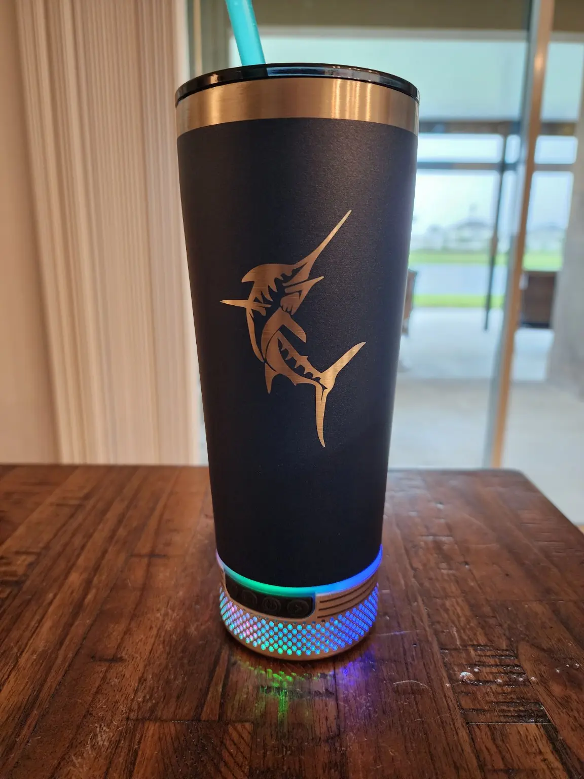 Custom black speaker tumbler with illuminated speaker base